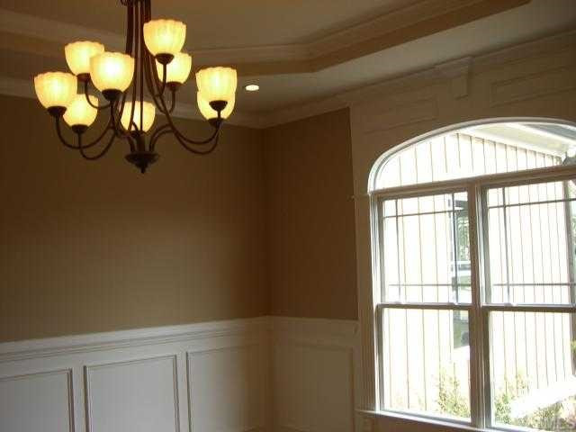 7204 Sparhawk Road Wake Forest, NC 27587 - Photo 6 of 12 Large dining room with wainscoting.