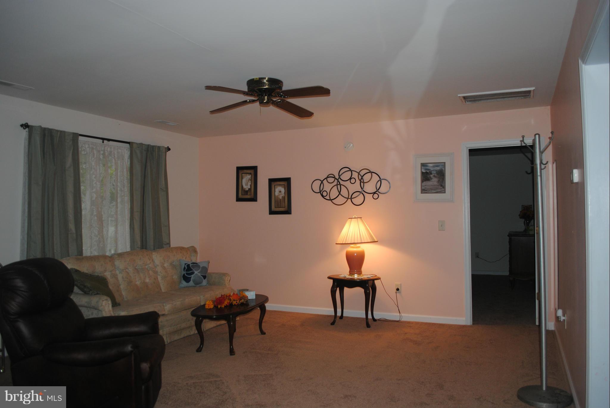 5767 Bay Road Rock Hall, MD 21661 - Photo 12 of 15 Living Room with doorway to master bedroom