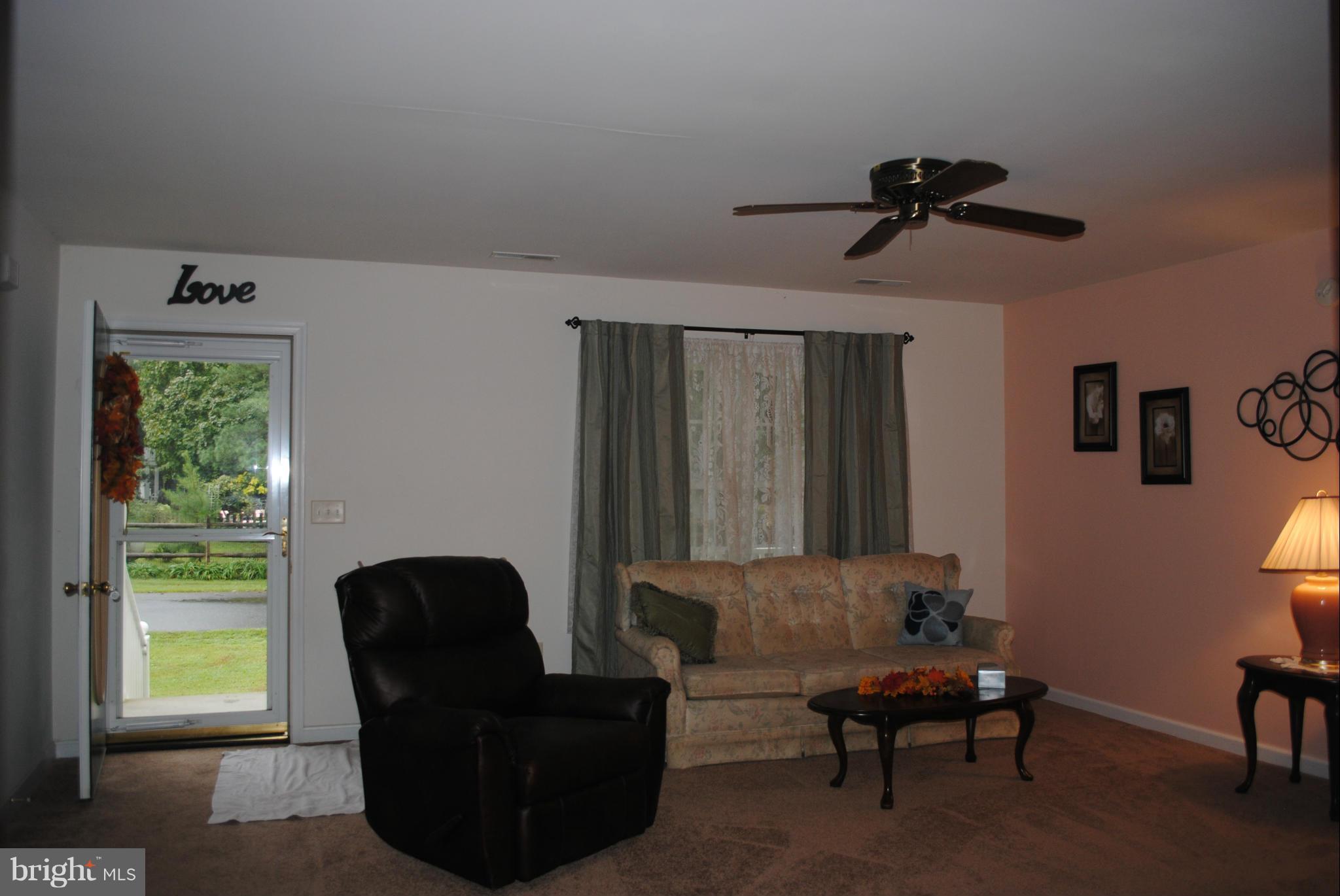 5767 Bay Road Rock Hall, MD 21661 - Photo 3 of 15 Front door entrance into Living Room