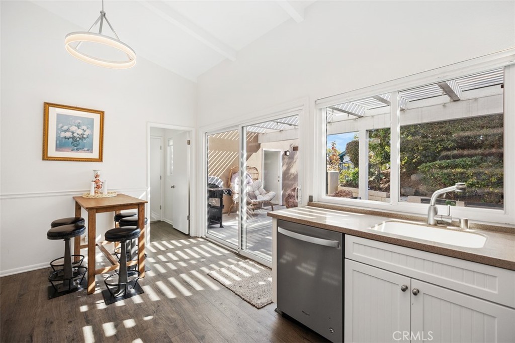 32321 Azores Road Dana Point, CA 92629 - Photo 13 of 30 a kitchen with sink refrigerator and large window