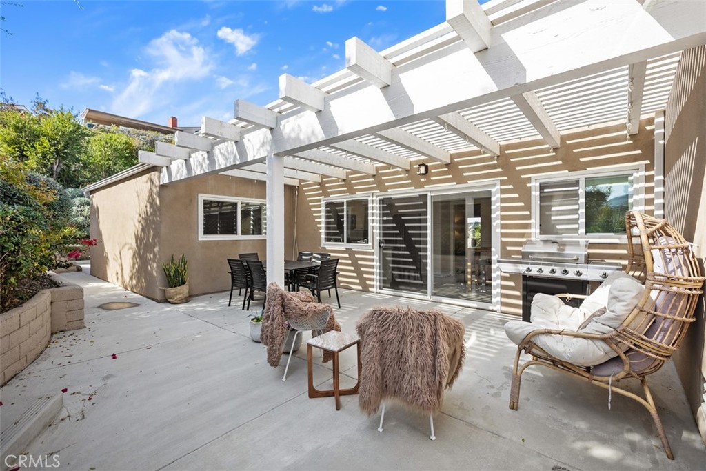 32321 Azores Road Dana Point, CA 92629 - Photo 25 of 30 a view of a patio with couches table and chairs and potted plants