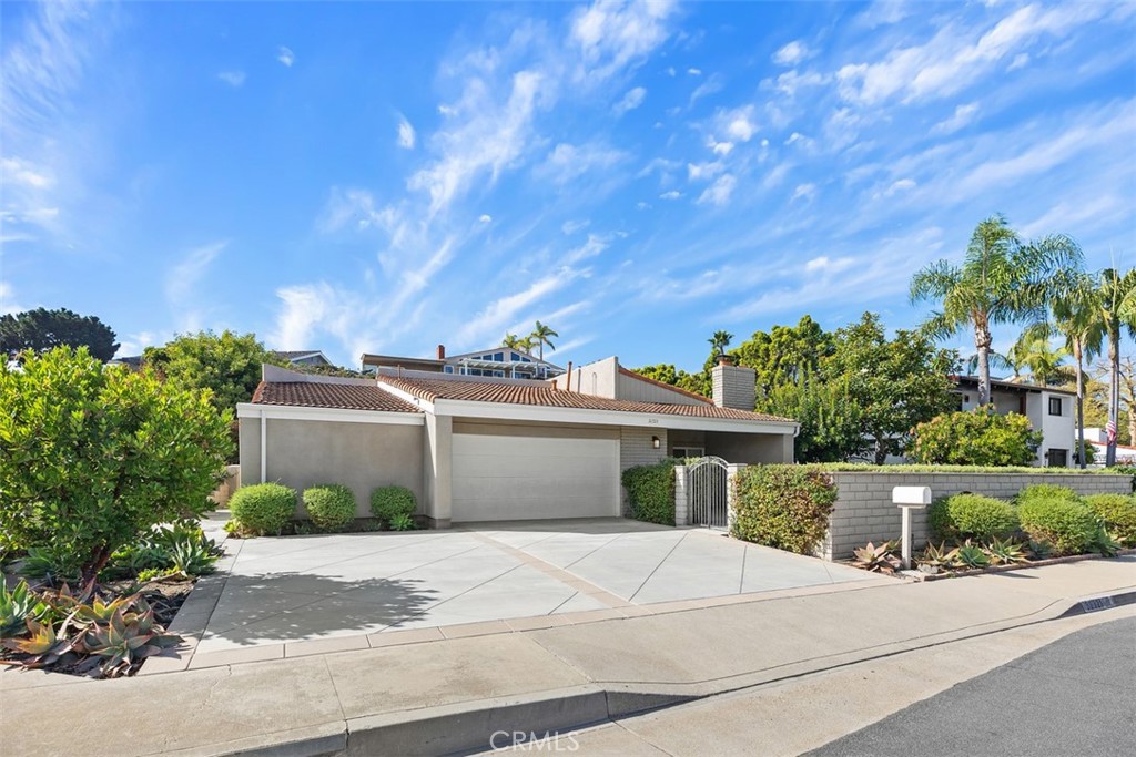 32321 Azores Road Dana Point, CA 92629 - Photo 28 of 30 a front view of a house with a yard and garage