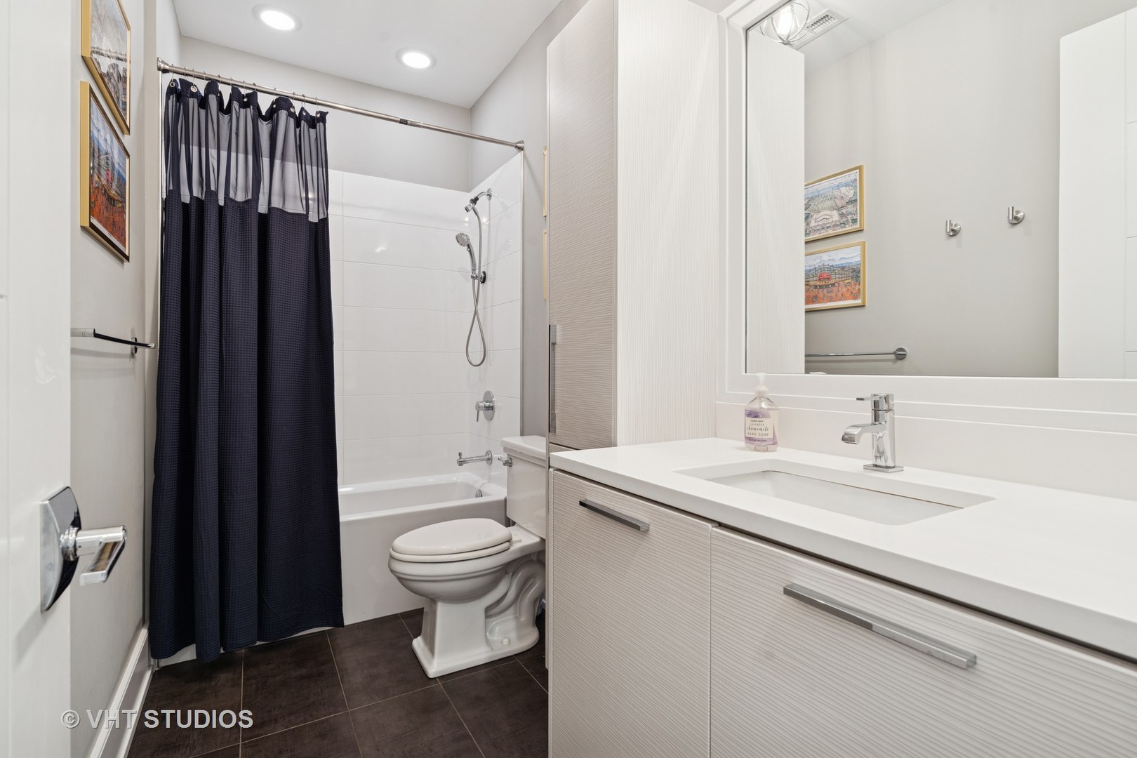 637 West Melrose Street, Unit 2 Chicago, IL 60657 - Photo 16 of 21 a bathroom with a granite countertop sink toilet and shower