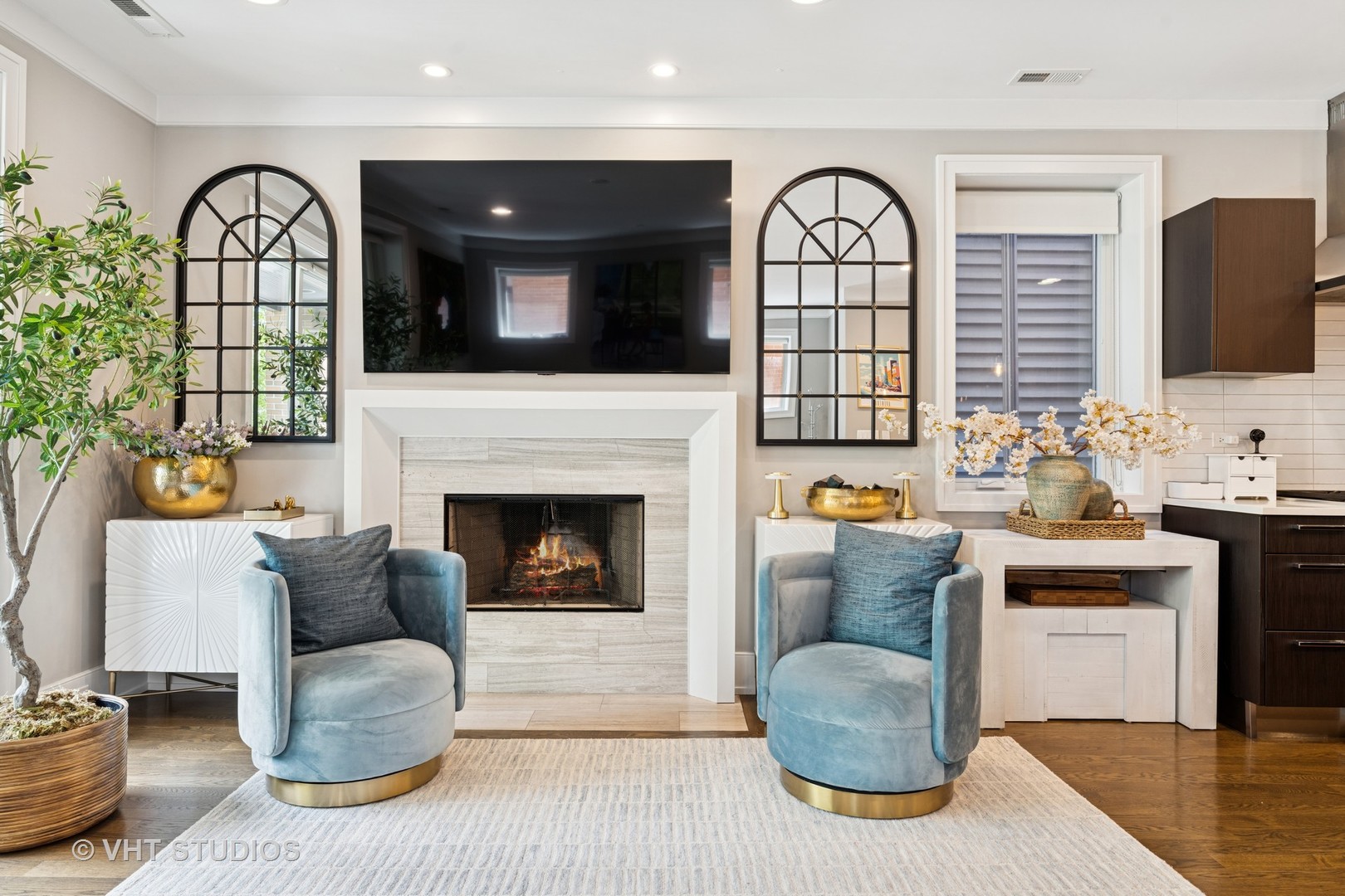 637 West Melrose Street, Unit 2 Chicago, IL 60657 - Photo 4 of 21 a living room with furniture a flat screen tv and a fireplace