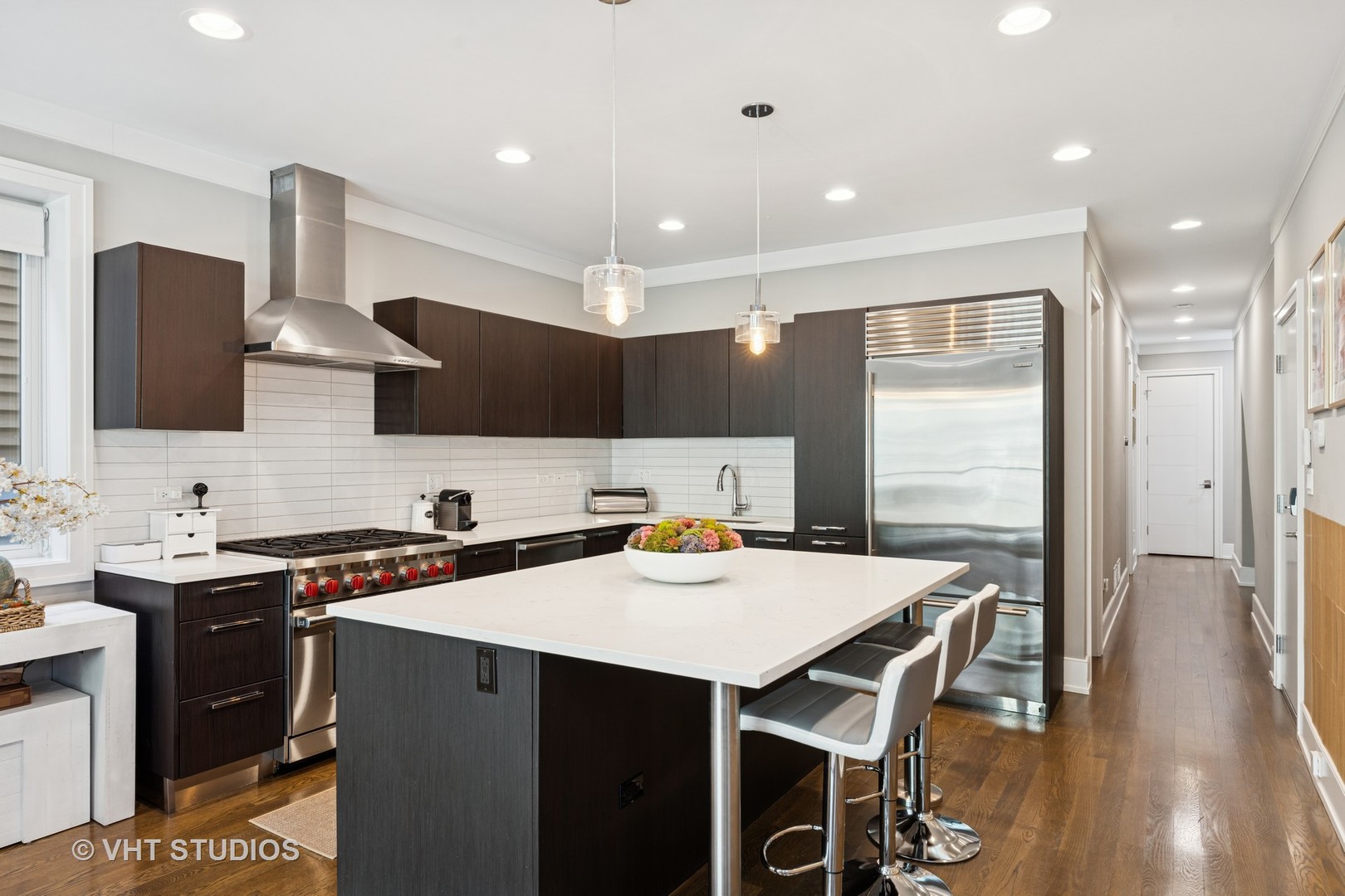 637 West Melrose Street, Unit 2 Chicago, IL 60657 - Photo 7 of 21 a kitchen with stainless steel appliances a sink stove and refrigerator