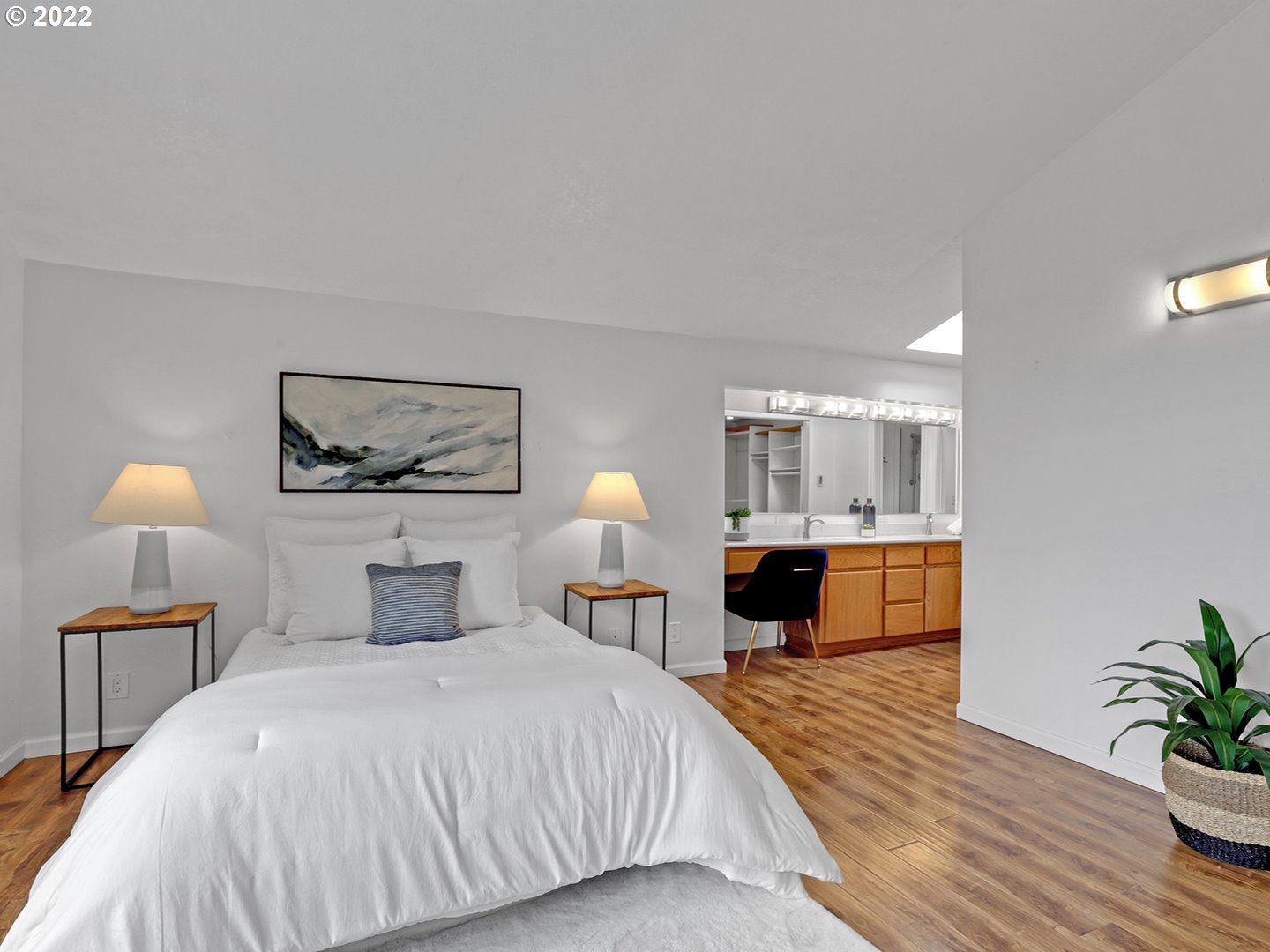 8500 Southwest Mapleridge Drive Portland, OR 97225 - Photo 13 of 30 a bedroom with a bed and a lamp