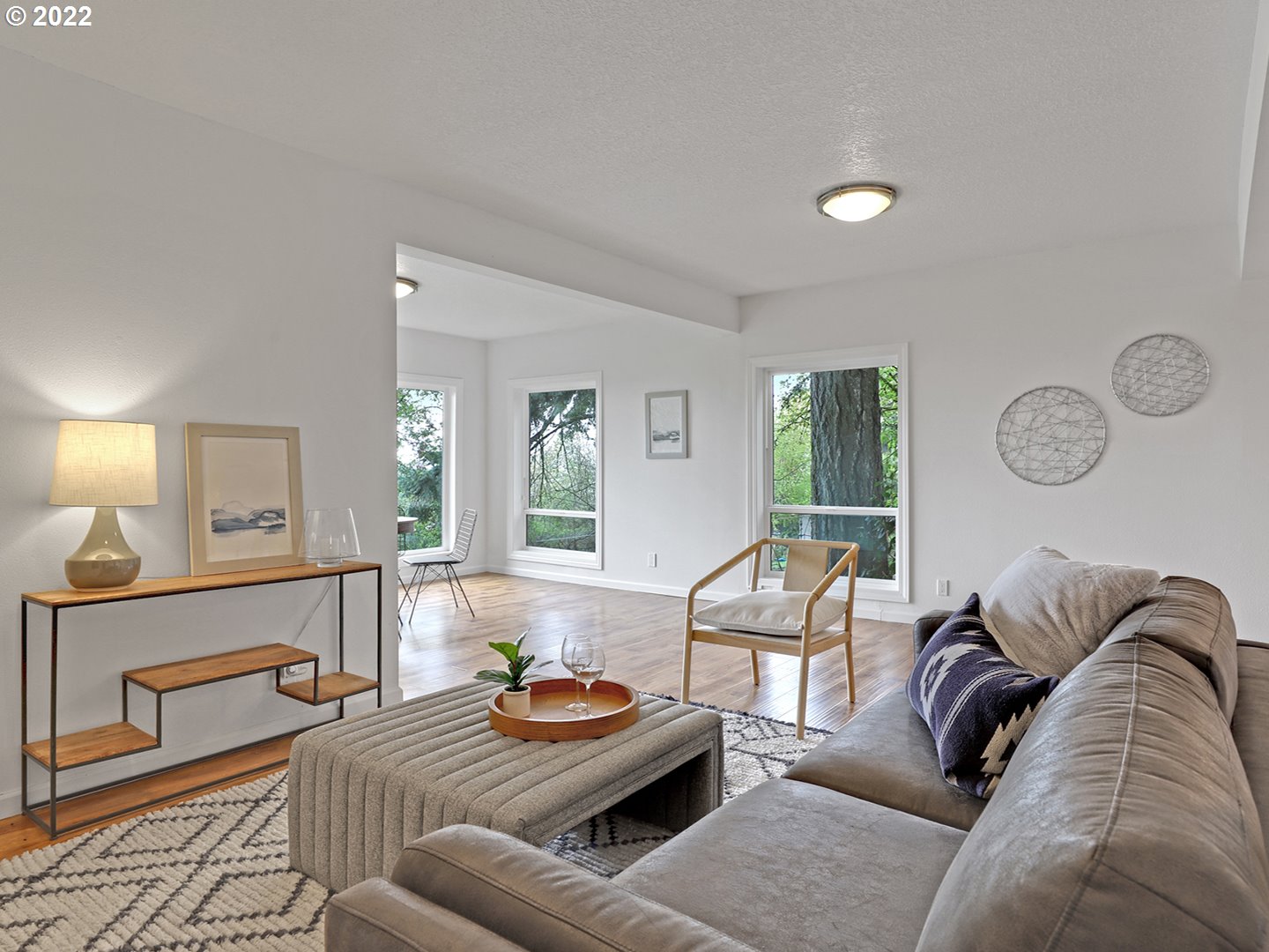 8500 Southwest Mapleridge Drive Portland, OR 97225 - Photo 16 of 30 a living room with furniture and a wooden floor
