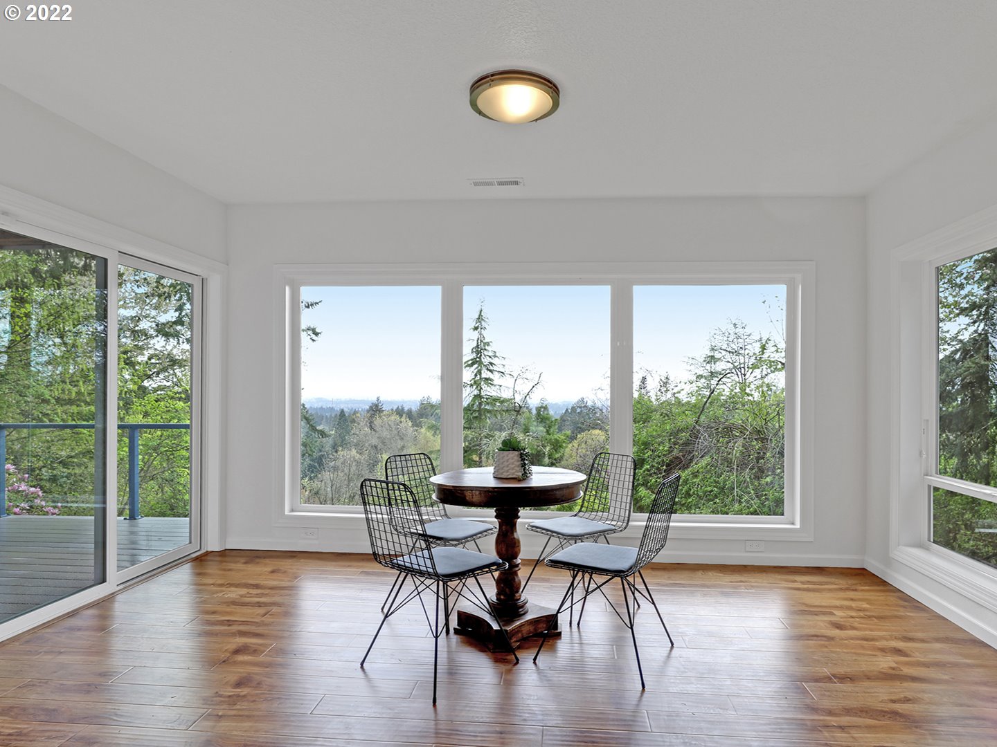8500 Southwest Mapleridge Drive Portland, OR 97225 - Photo 18 of 30 a dining room with furniture and wooden floor