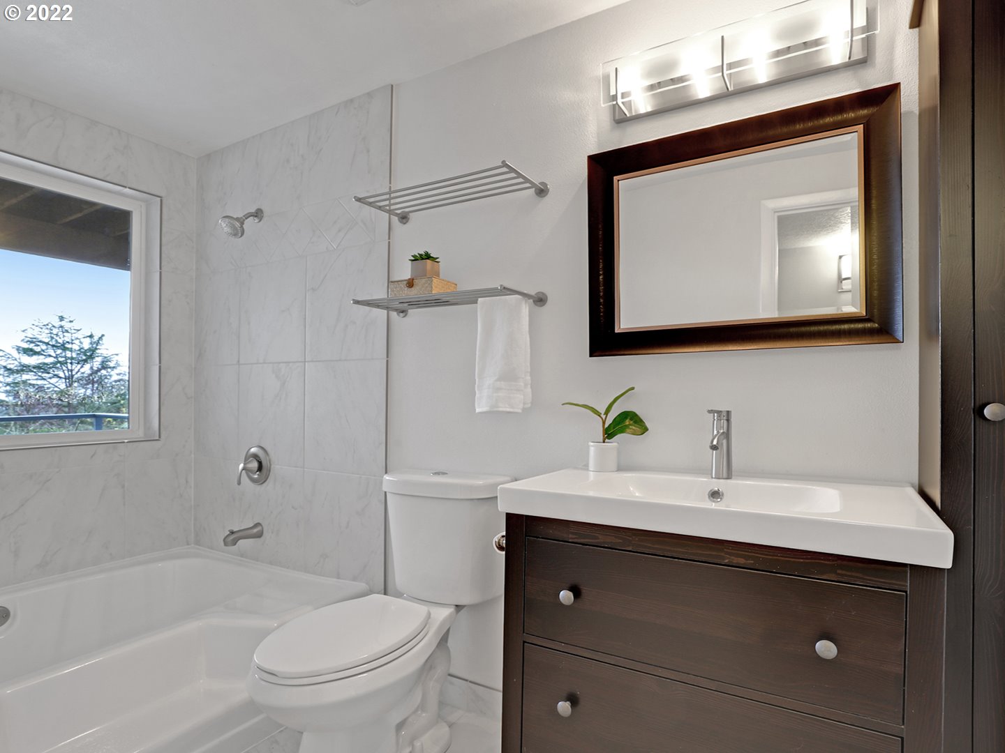 8500 Southwest Mapleridge Drive Portland, OR 97225 - Photo 23 of 30 a bathroom with a toilet sink vanity tub and mirror