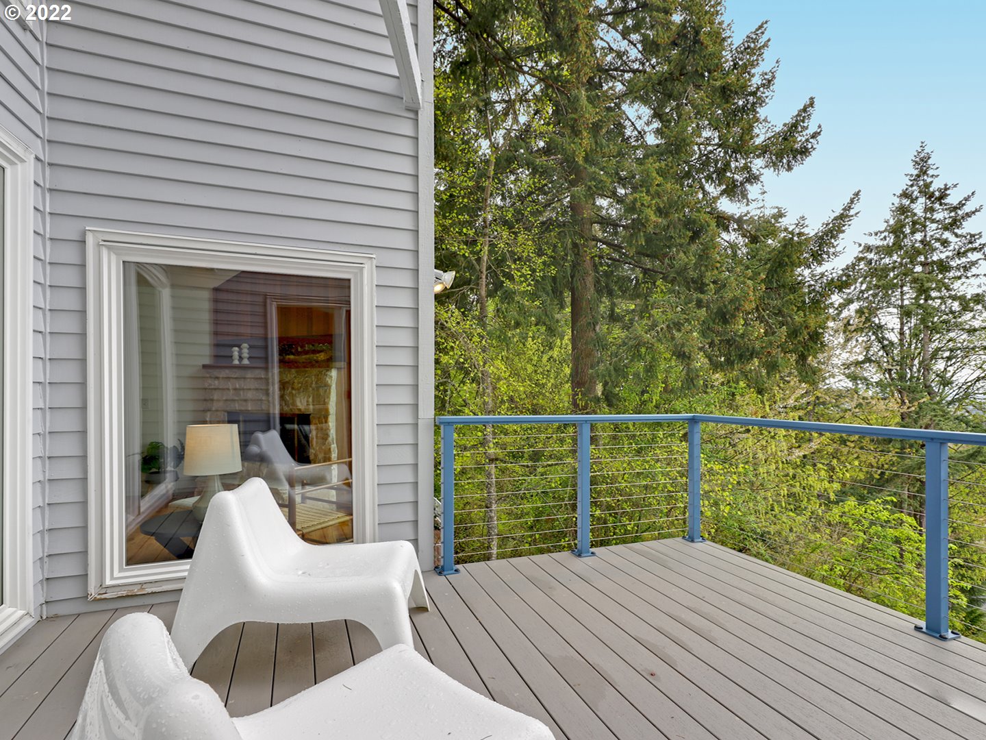8500 Southwest Mapleridge Drive Portland, OR 97225 - Photo 24 of 30 a balcony with furniture and wooden floor