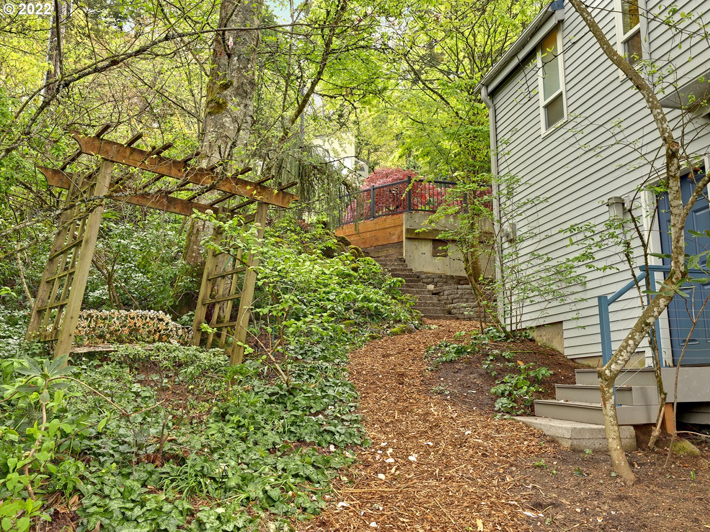 8500 Southwest Mapleridge Drive Portland, OR 97225 - Photo 28 of 30 a backyard of a house with lots of green space