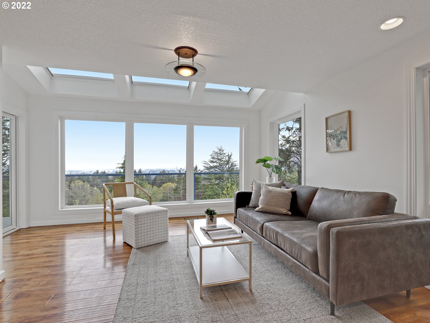 8500 Southwest Mapleridge Drive Portland, OR 97225 - Photo 6 of 30 a living room with furniture and a large window