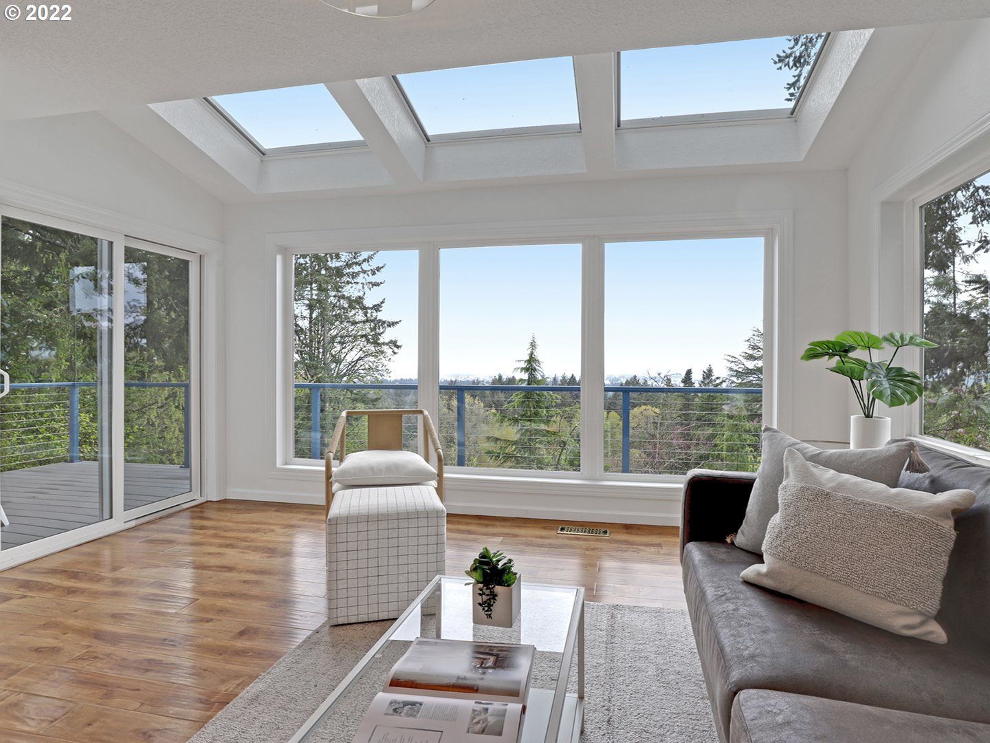 8500 Southwest Mapleridge Drive Portland, OR 97225 - Photo 7 of 30 a living room with furniture and floor to ceiling windows