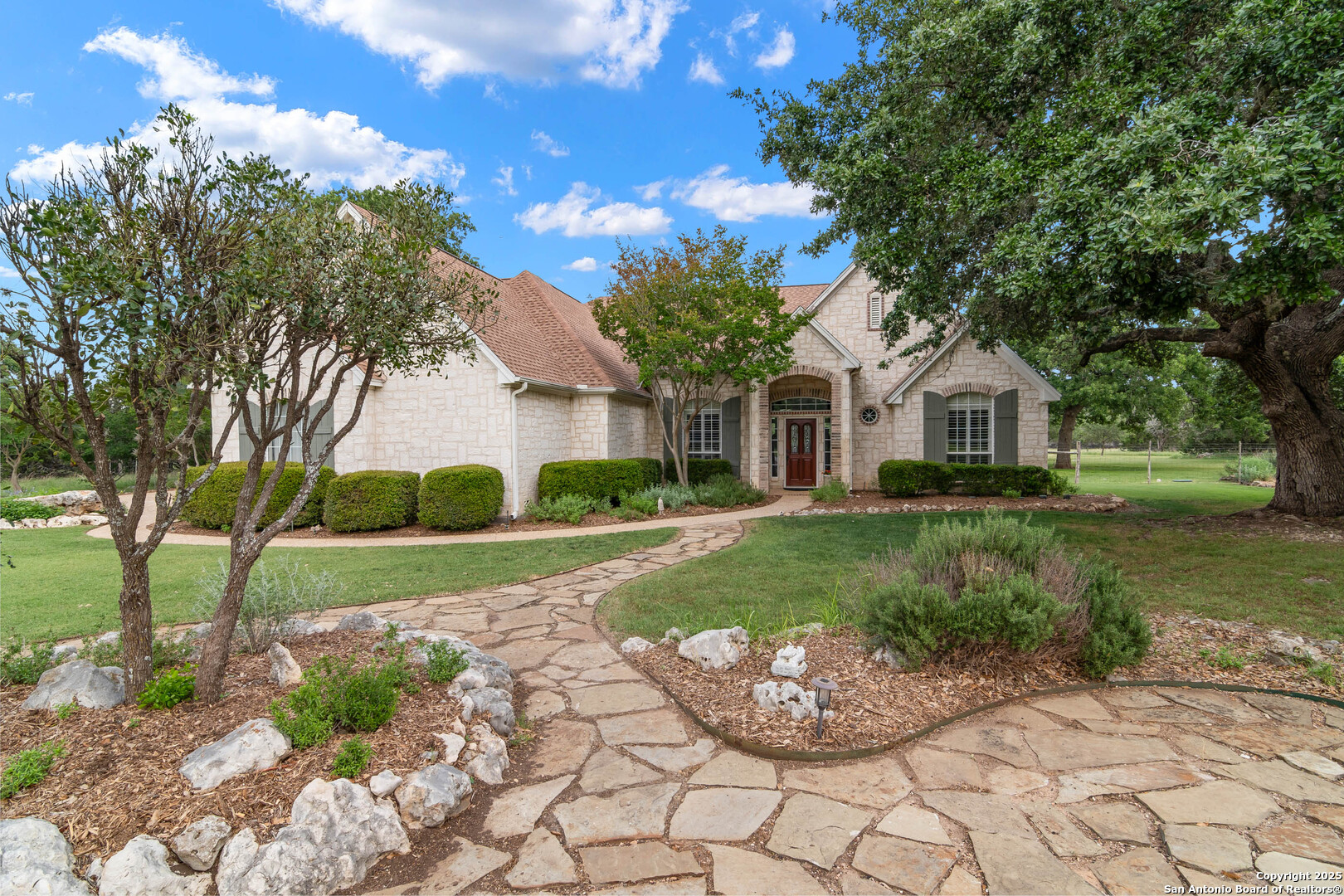 a front view of a house with a yard