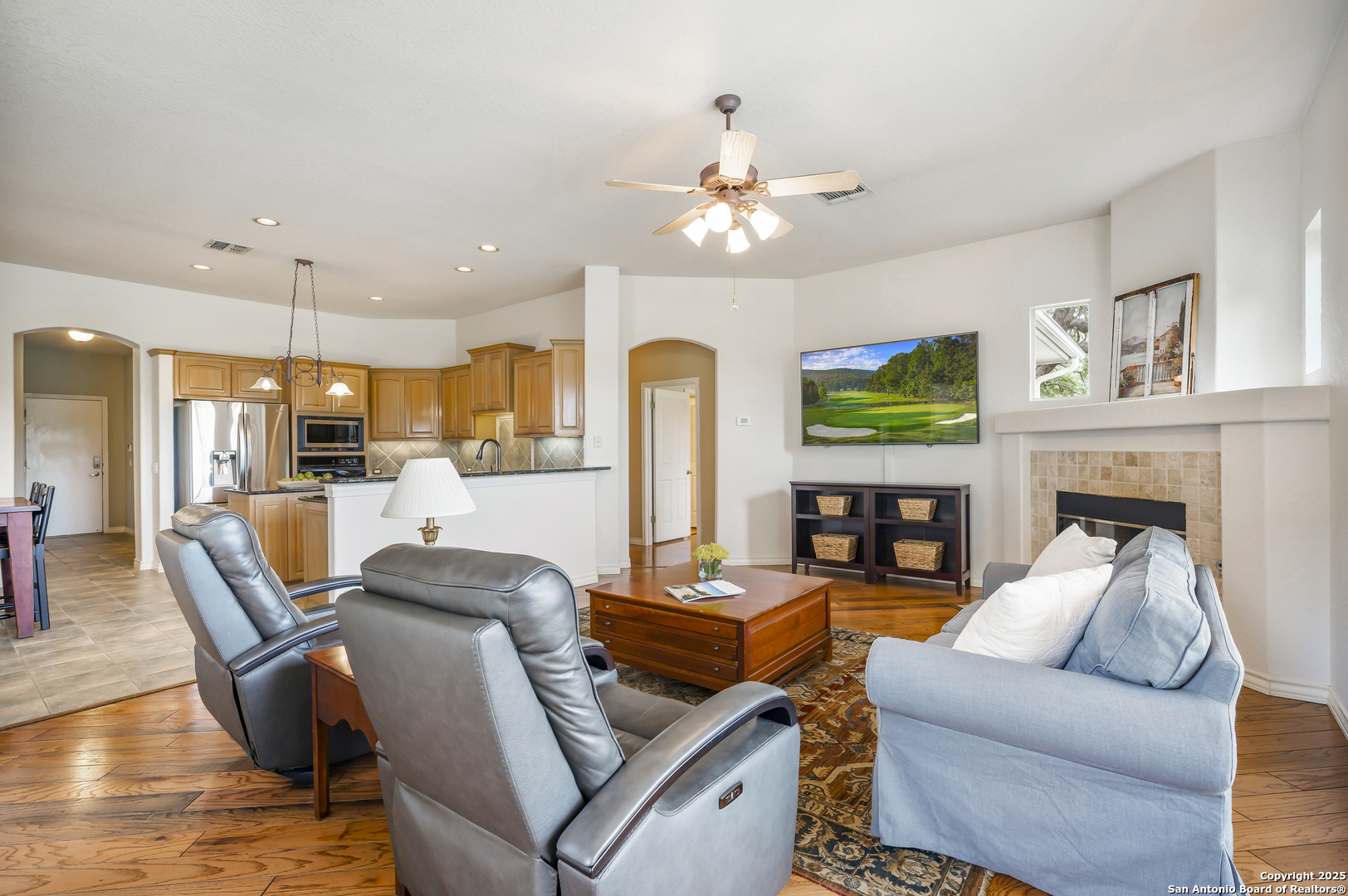221 Park Ridge Boerne, TX 78006 - Photo 12 of 35 a living room with fireplace furniture and a chandelier
