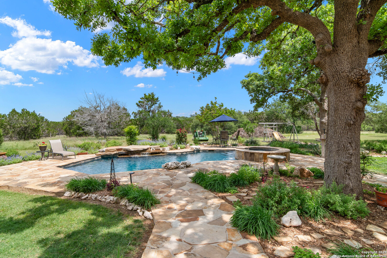 221 Park Ridge Boerne, TX 78006 - Photo 2 of 35 a view of swimming pool with outdoor seating and plants