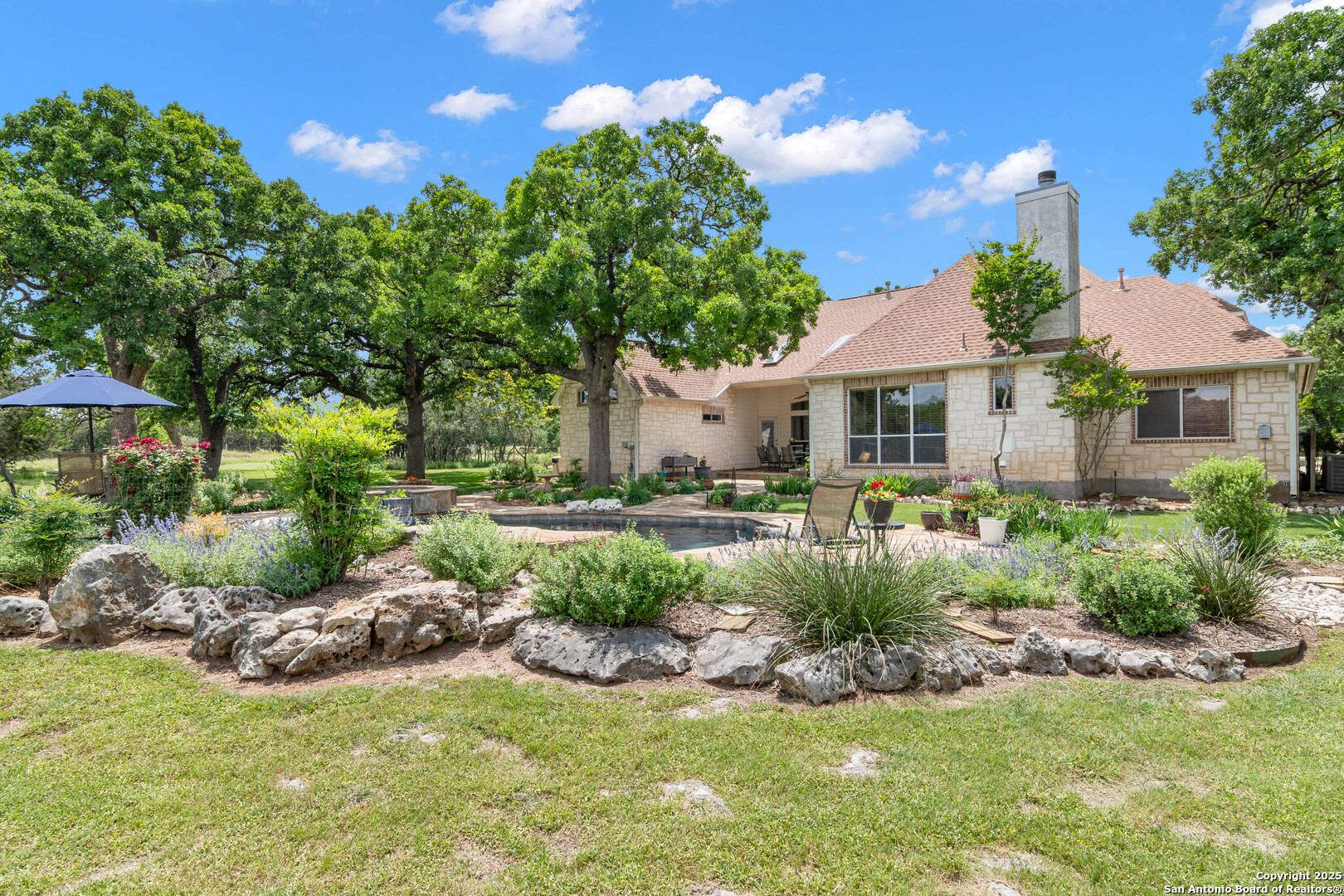 221 Park Ridge Boerne, TX 78006 - Photo 31 of 35 a view of a house with a yard and potted plants