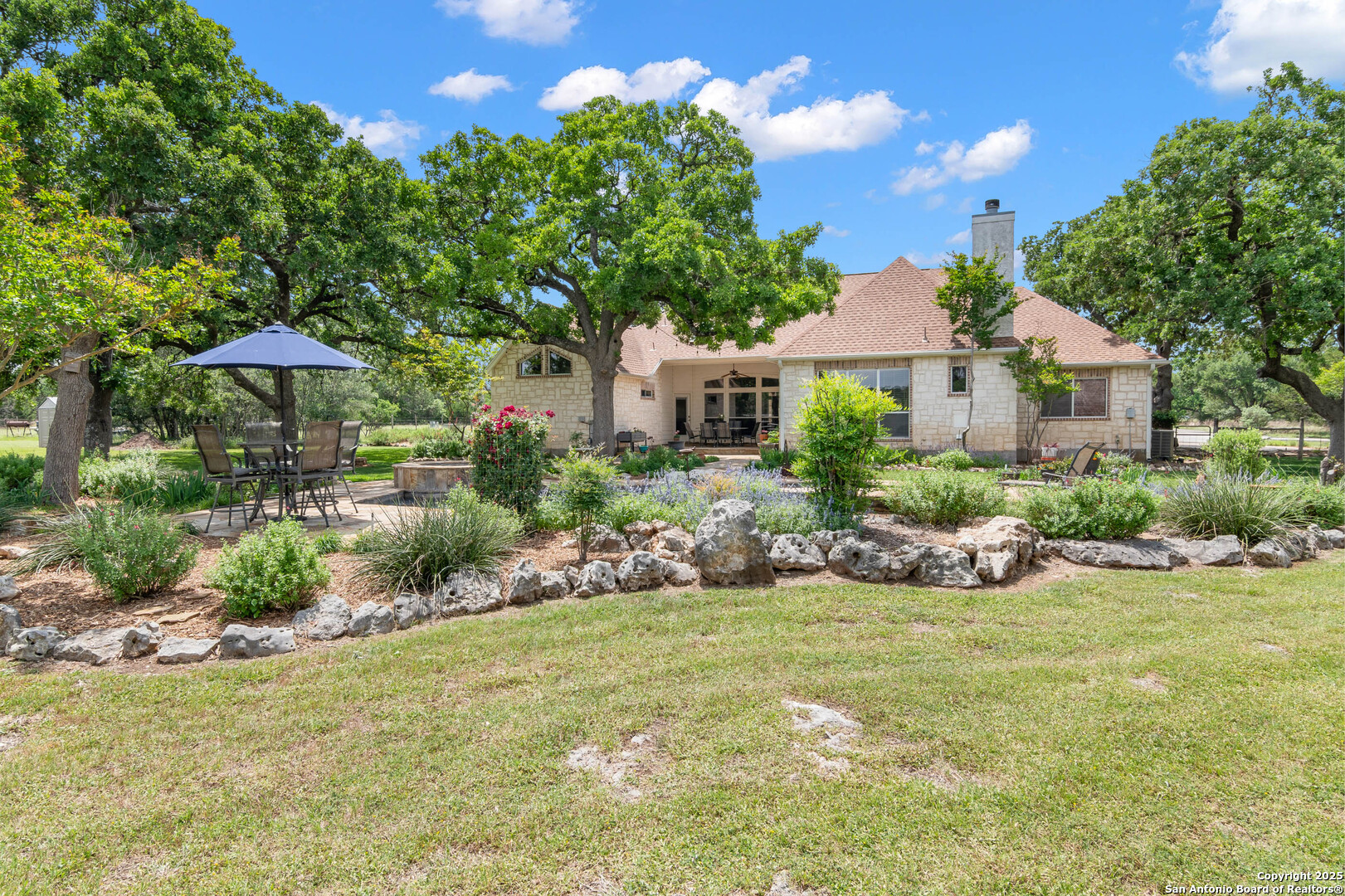 221 Park Ridge Boerne, TX 78006 - Photo 32 of 35 a front view of a house with a yard and potted plants