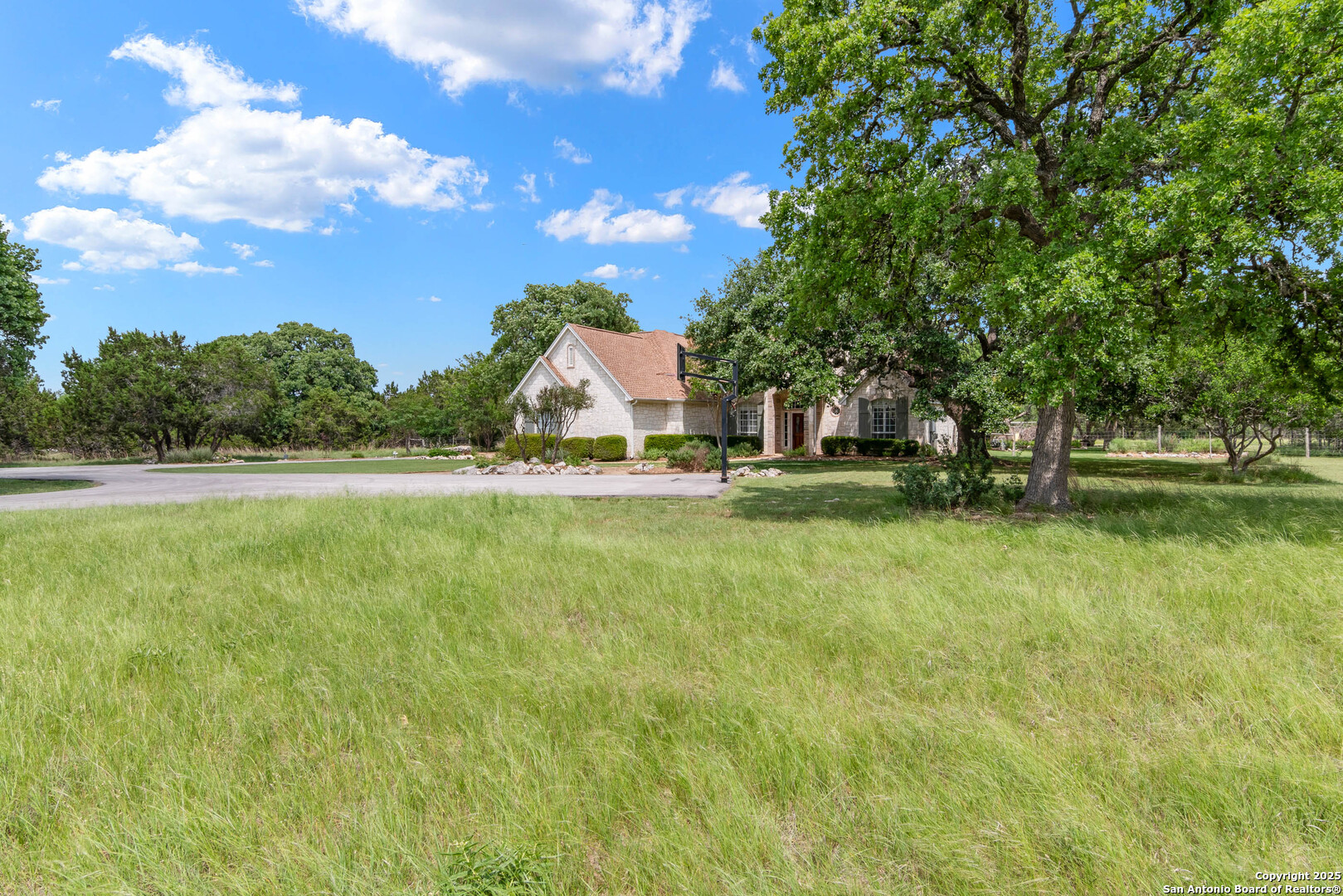 221 Park Ridge Boerne, TX 78006 - Photo 35 of 35 a view of swimming pool with yard and trees in the background