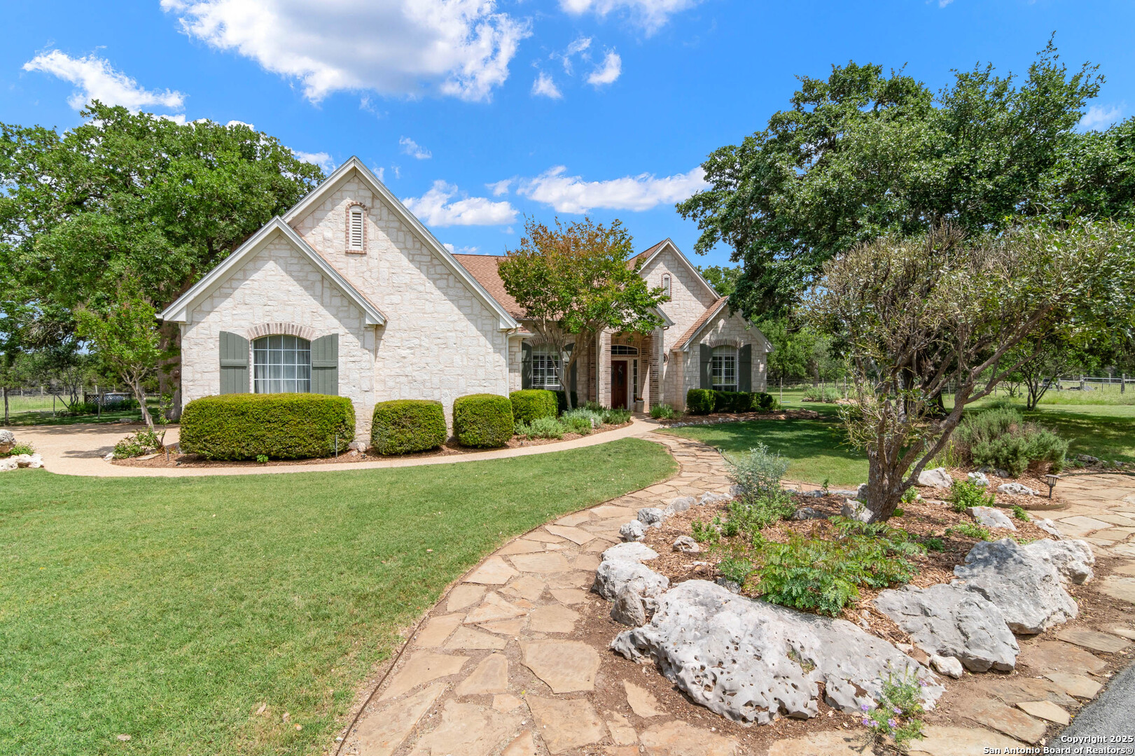 221 Park Ridge Boerne, TX 78006 - Photo 6 of 35 a front view of a house with a yard