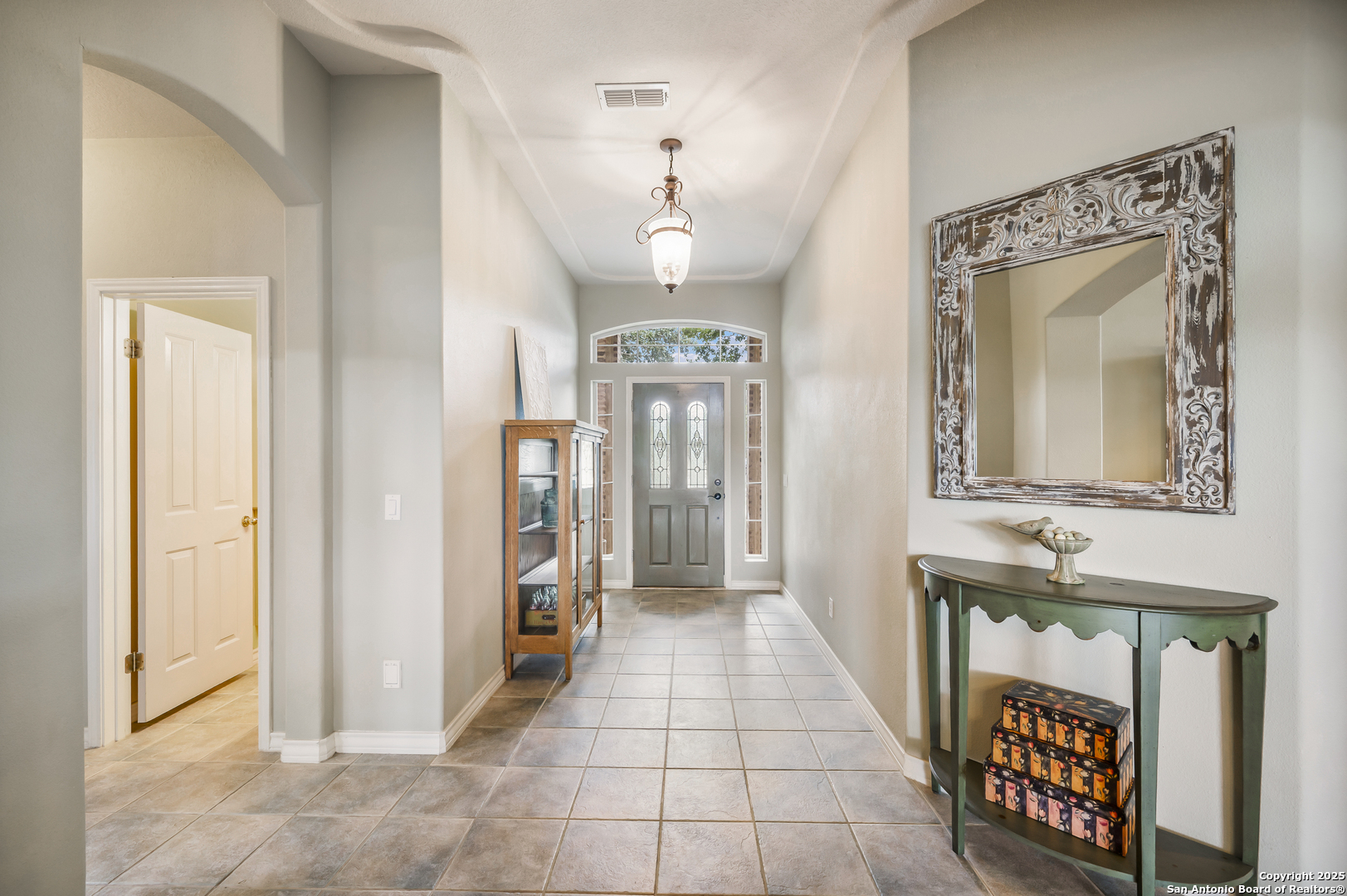 221 Park Ridge Boerne, TX 78006 - Photo 7 of 35 a hallway with a mirror and a dresser