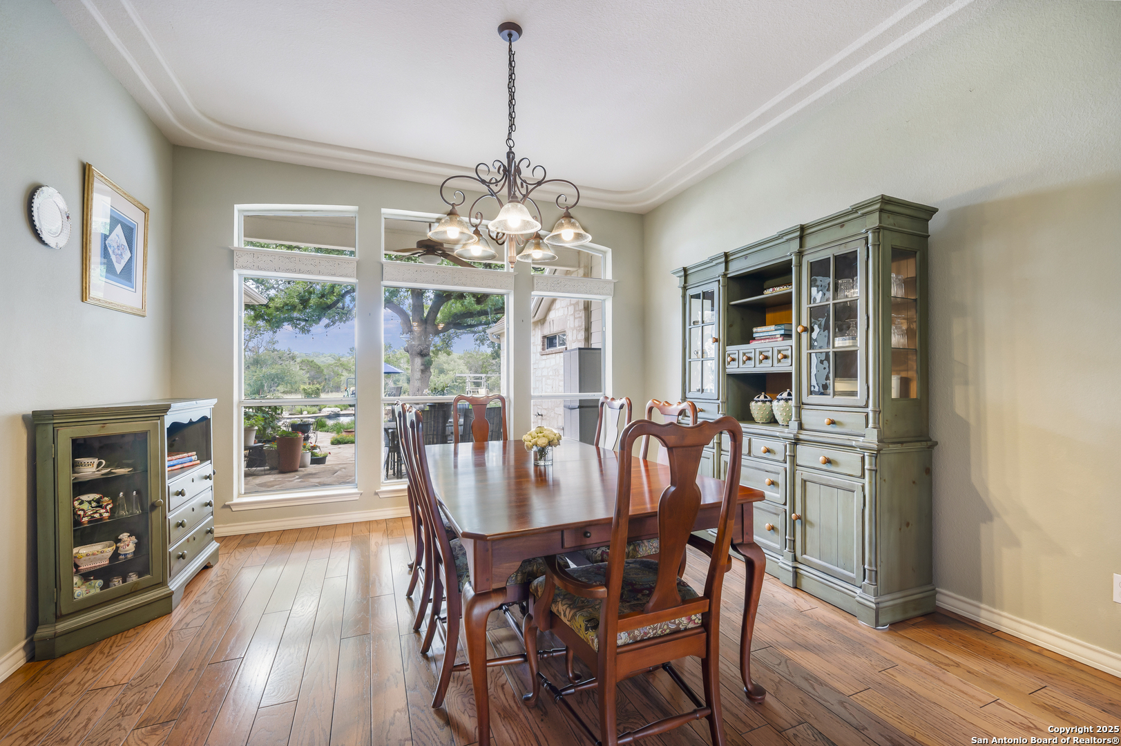 221 Park Ridge Boerne, TX 78006 - Photo 9 of 35 a view of a dining room with furniture wooden floor and chandelier