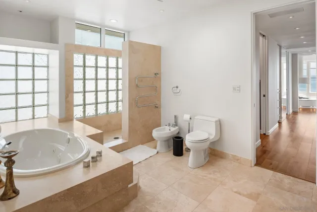 a kitchen with stainless steel appliances kitchen island granite countertop a stove a sink and a microwave