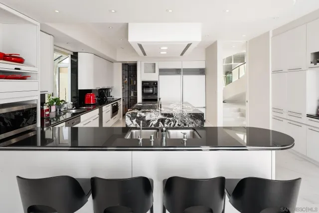 a bedroom with a bed and a mirror