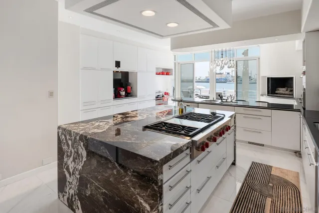 a bedroom with a bed and large window