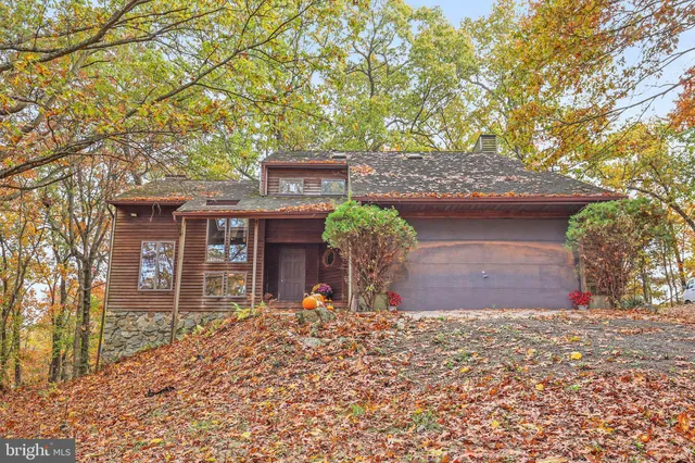 front view of a house with a tree