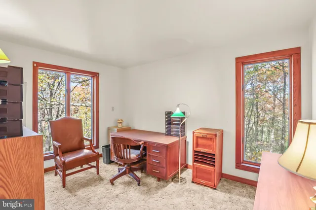 a bedroom with furniture and a window