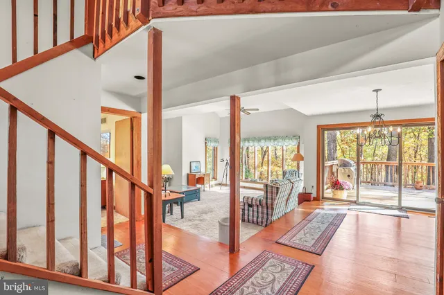 a view of an entryway with wooden floor