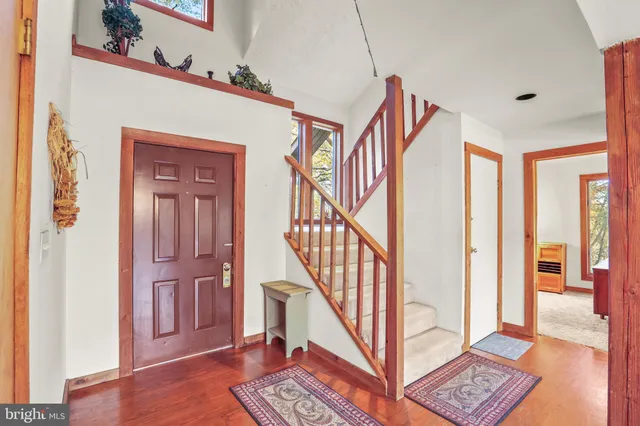 a view of an entryway with wooden floor