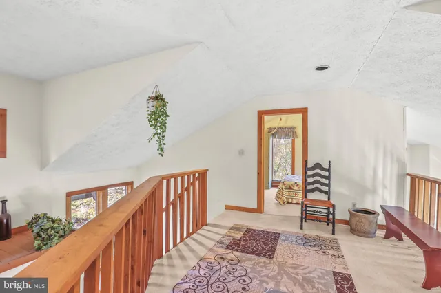 a bedroom with furniture and wooden floor