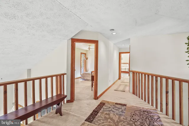 a view of a hallway with windows