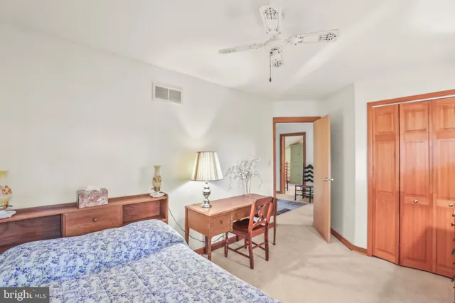 a bedroom with furniture and a chandelier