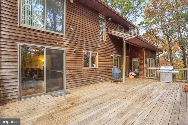 a view of a house with a snow in the yard