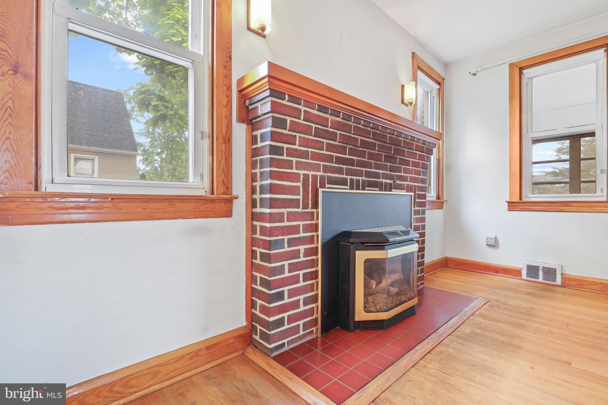 1054 Minnetonka Road Severn, MD 21144 - Photo 13 of 84 Brick fireplace with gas insert