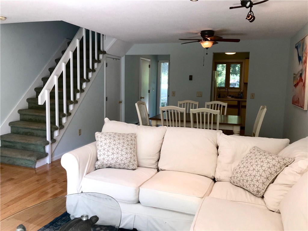 335 South Pier Road, Unit 3B Narragansett, RI 02882 - Photo 4 of 29 Living Room into Dining area, Kitchen, front door and stairs to bedrooms