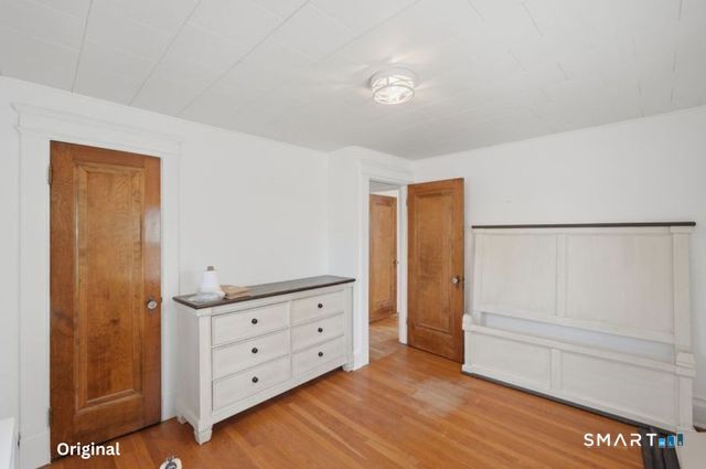 443 Highland Avenue Waterbury, CT 06708 - Photo 16 of 24 a view of room with wooden floor