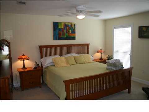 132 Emerald Ridge Santa Rosa Beach, FL 32459 - Photo 11 of 15 a bedroom with a bed and a window