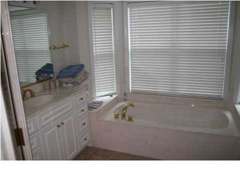 132 Emerald Ridge Santa Rosa Beach, FL 32459 - Photo 12 of 15 a bathroom with a tub sink and mirror