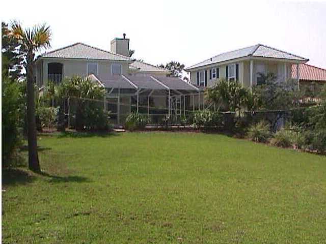 132 Emerald Ridge Santa Rosa Beach, FL 32459 - Photo 3 of 15 a front view of a house with garden