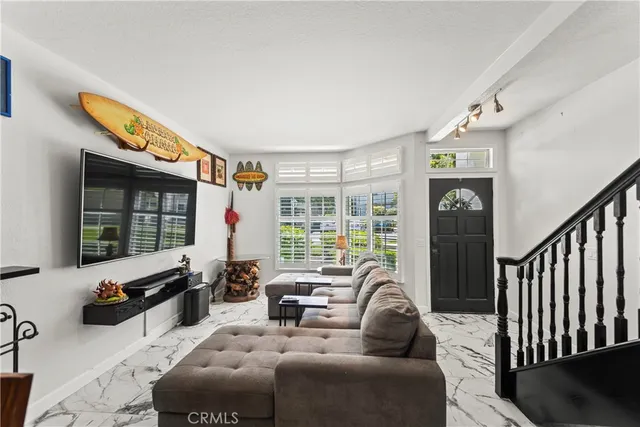 a view of a livingroom with furniture and windows