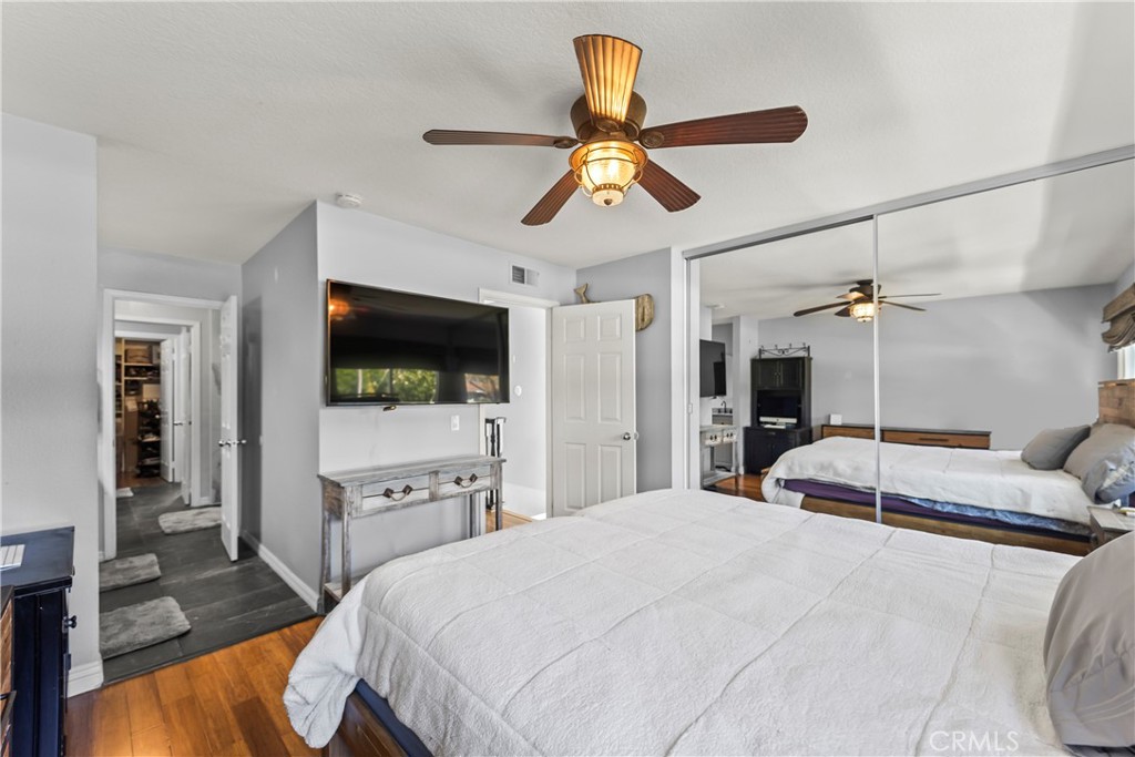 23653 Lexington Court, Unit 2 Laguna Niguel, CA 92677 - Photo 17 of 30 a bedroom with a bed and a flat screen tv