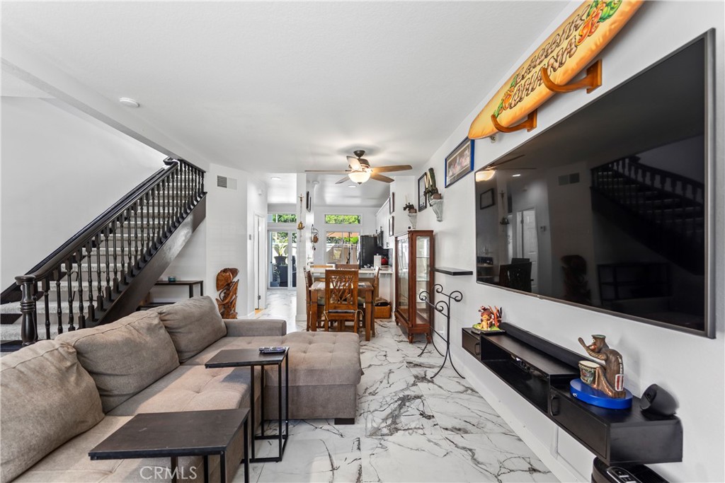 23653 Lexington Court, Unit 2 Laguna Niguel, CA 92677 - Photo 2 of 30 a living room with furniture and a flat screen tv