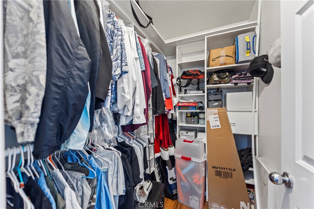 23653 Lexington Court, Unit 2 Laguna Niguel, CA 92677 - Photo 24 of 30 a view of walk in closet with clothes