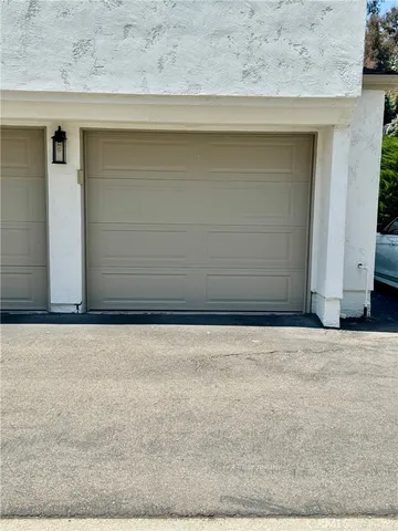 a wooden bench sitting in front of a building