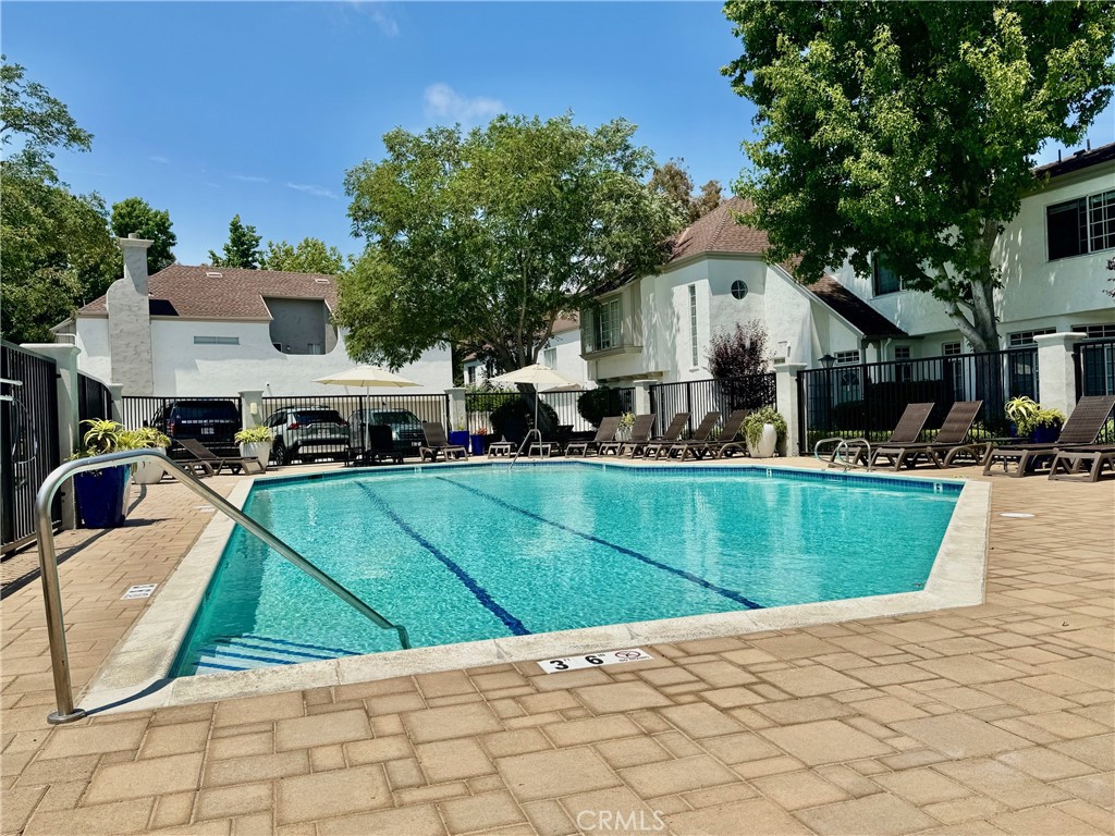 23653 Lexington Court, Unit 2 Laguna Niguel, CA 92677 - Photo 29 of 30 a view of a house with a swimming pool
