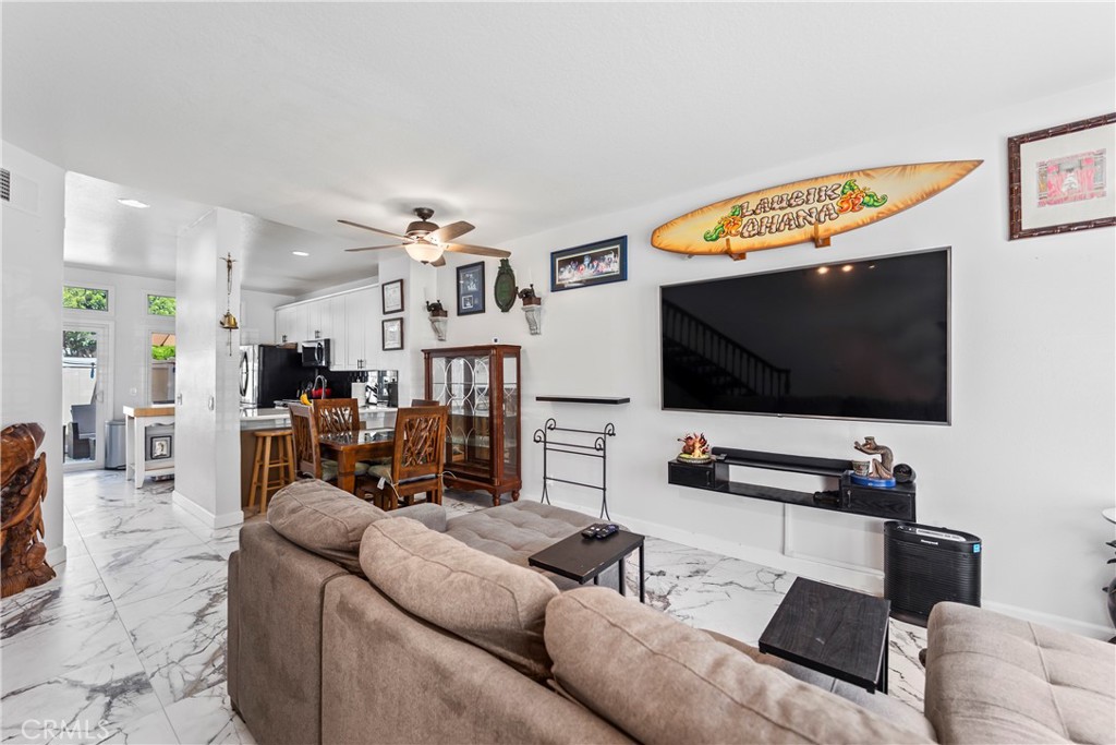 23653 Lexington Court, Unit 2 Laguna Niguel, CA 92677 - Photo 6 of 30 a living room with furniture and a flat screen tv